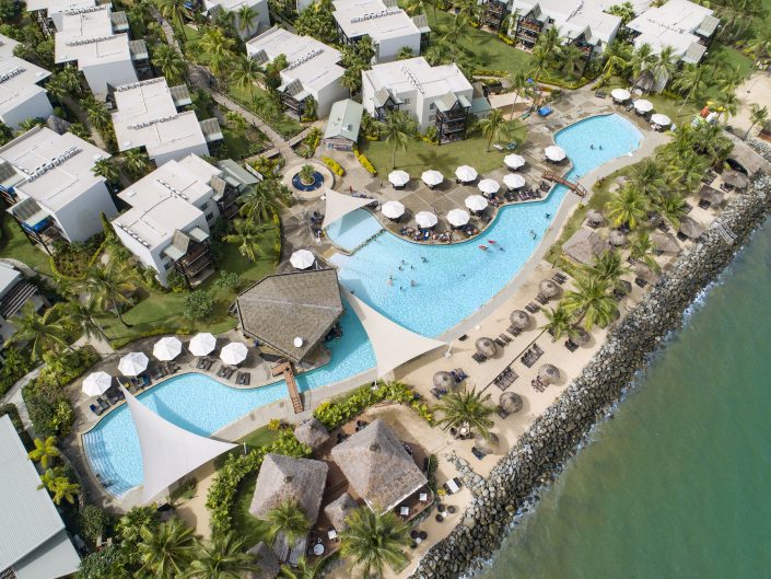 Aerial view of a luxury resort surrounded by lush greenery